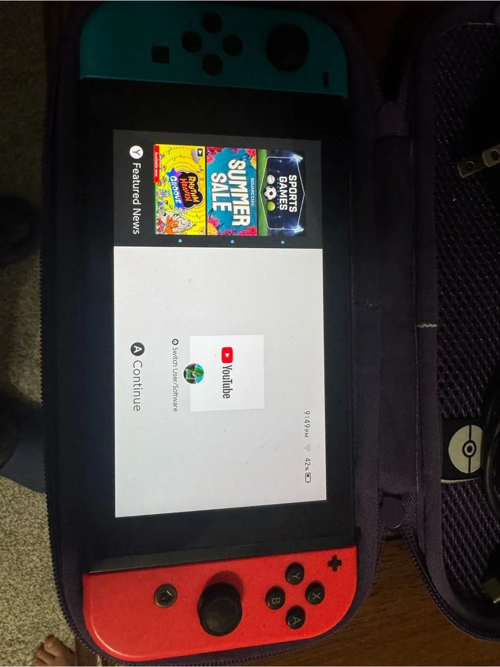 Nintendo Switch with Blue Left & Red Right Joy-Con and Purple Carry Case